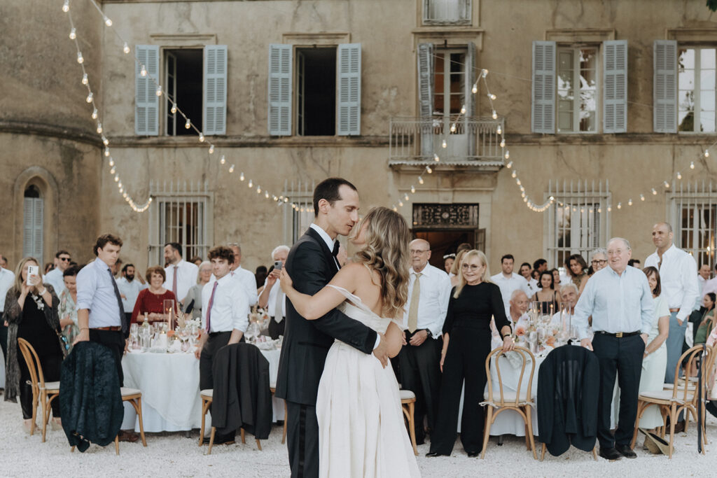 Bride-and-groom-sharing-first-dance-romantic-and-emotional-moment-wedding-in-provence-chateau-de-robernier-sea-bride-and-sun